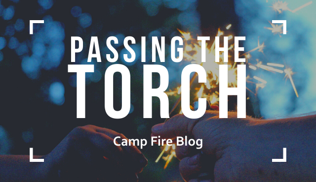 passing the torch, camp fire blog, sparkler in two hands