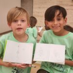 Camp Fire Summer Day Camp participants show their drawings at Kimbell Art Museum in Fort Worth.