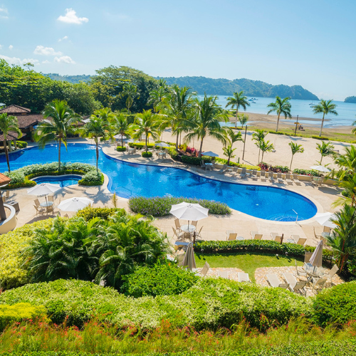 Photo of Costa Rica Lux Resort with a pool, palm trees and ocean view